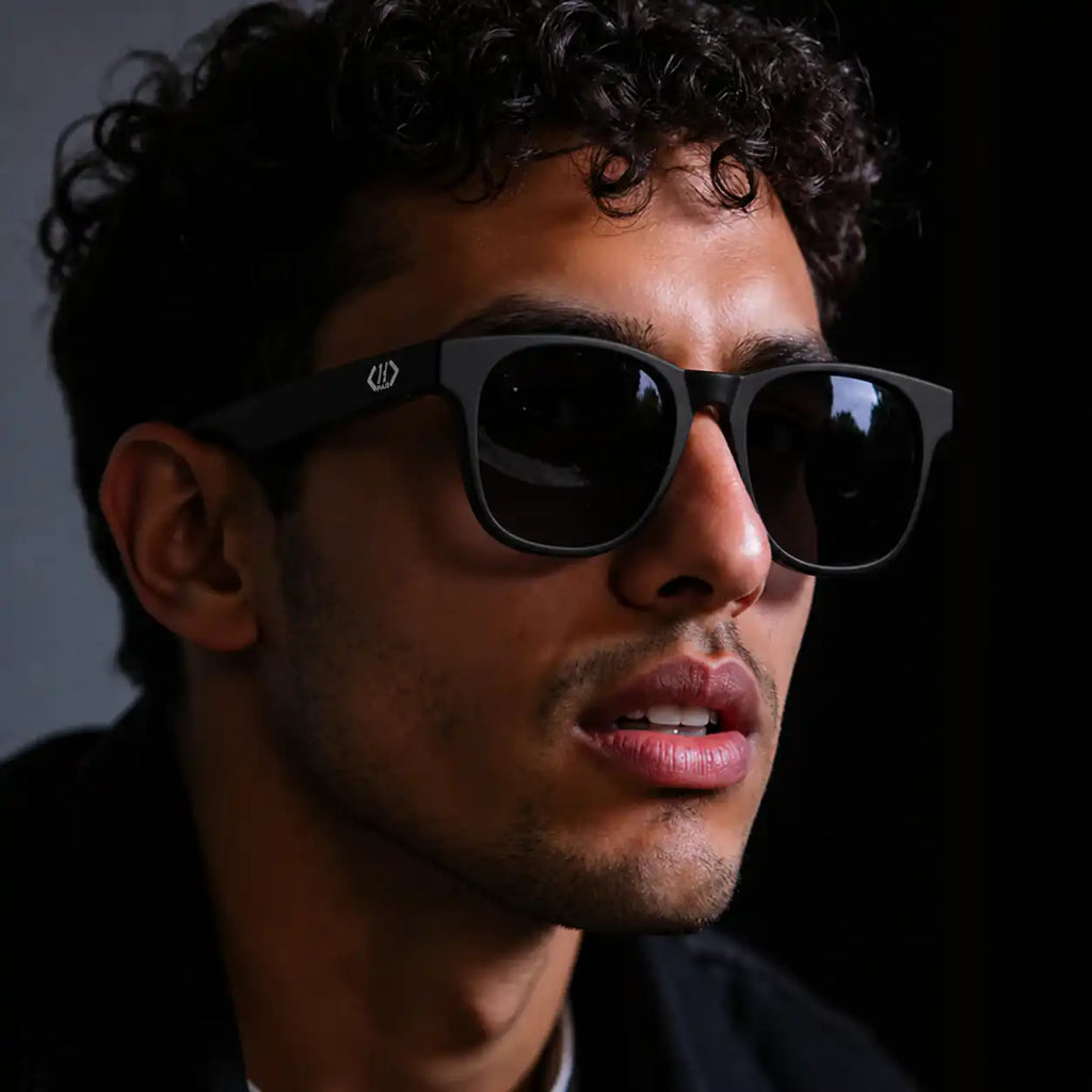 Black PAB Re:Vision Wayfarers by noQMall featuring polarized lenses and UV protection, showcasing sustainable eyewear style.